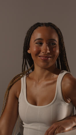 Studio-Beauty-Shot-Of-Young-Woman-With-Long-Braided-Hair-Against-Neutral-Background-In-Profile-2